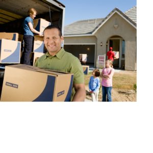 Photo of smiling, young Spanish family moving in to their new home on moving day
