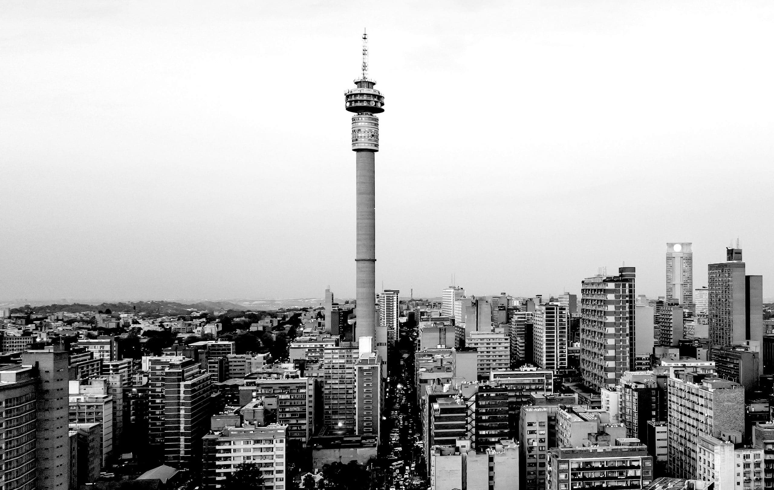 Johannesburg Skyline in black and white, overcast day with the Hilbrow Tower featured prominently in the center