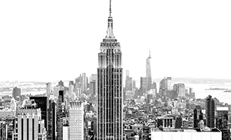 Skyline of Manhattan looking South with the Empire State Building prominently positioned in the foreground (black and white).