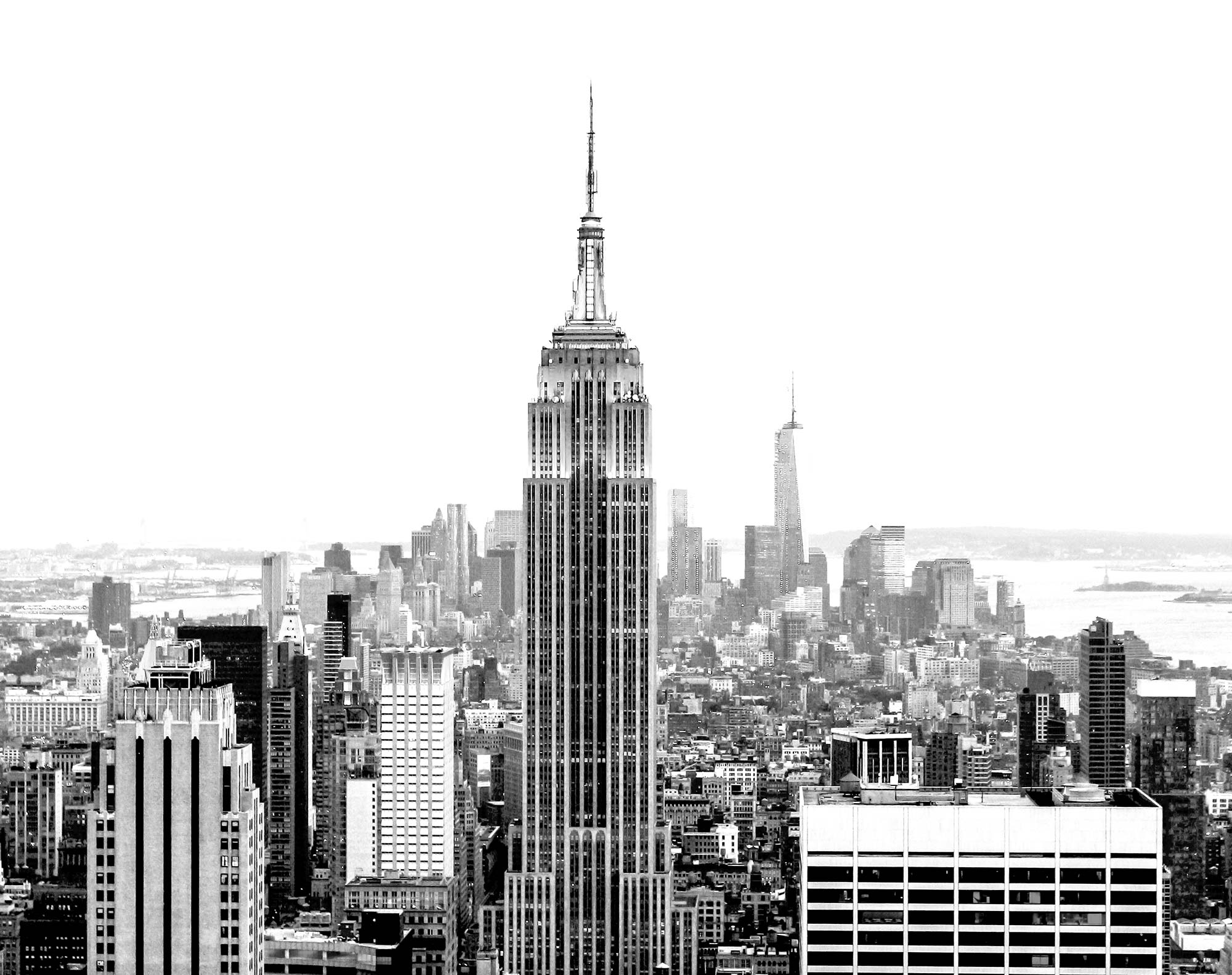 Skyline of Manhattan looking South with the Empire State Building prominently positioned in the foreground (black and white).