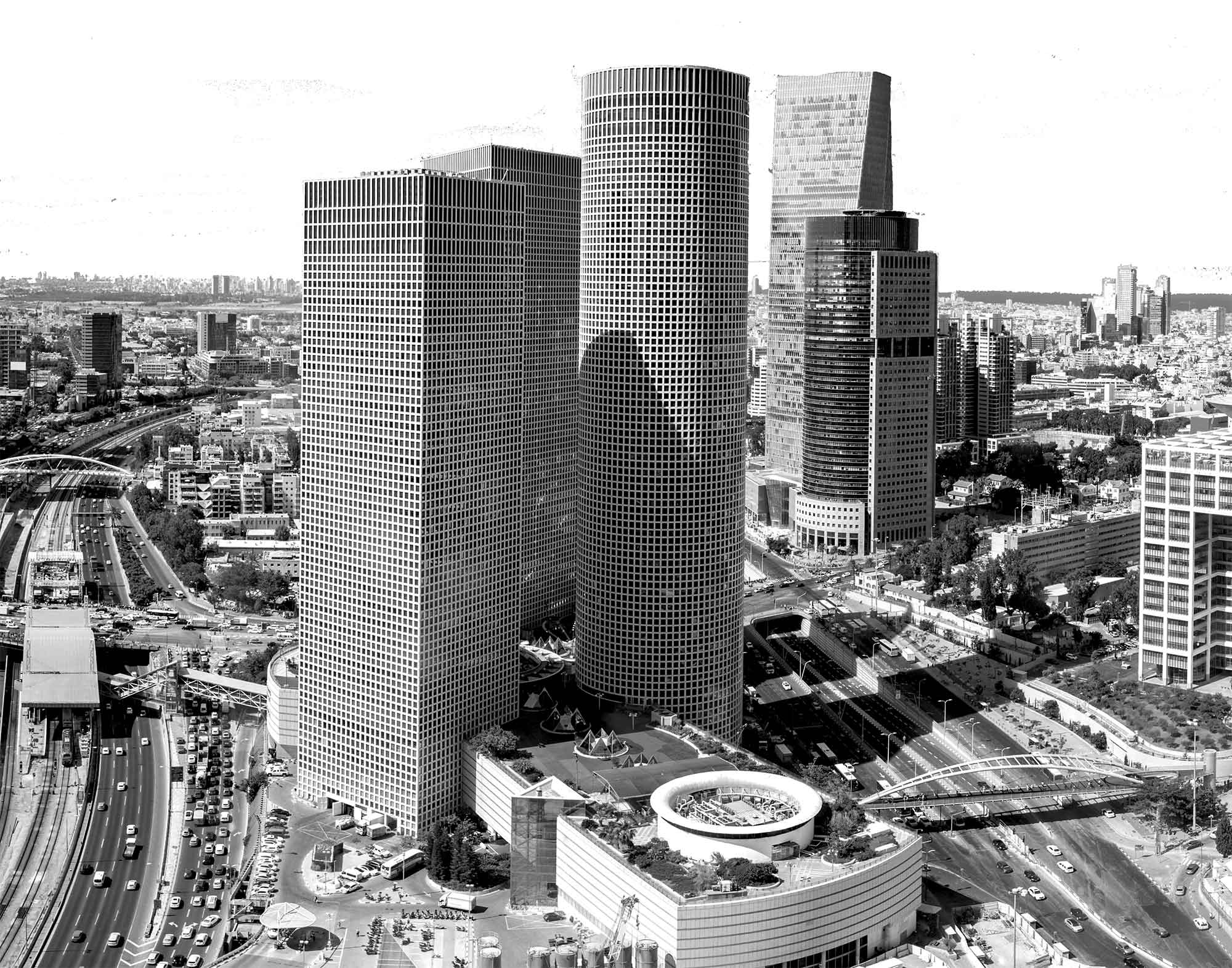 Part of Tel Aviv Skyline (in black and white). In the foreground, the Azrieli Towers Complex, and in the mid background to the right, the Sarona Tower and Africa-Israel building