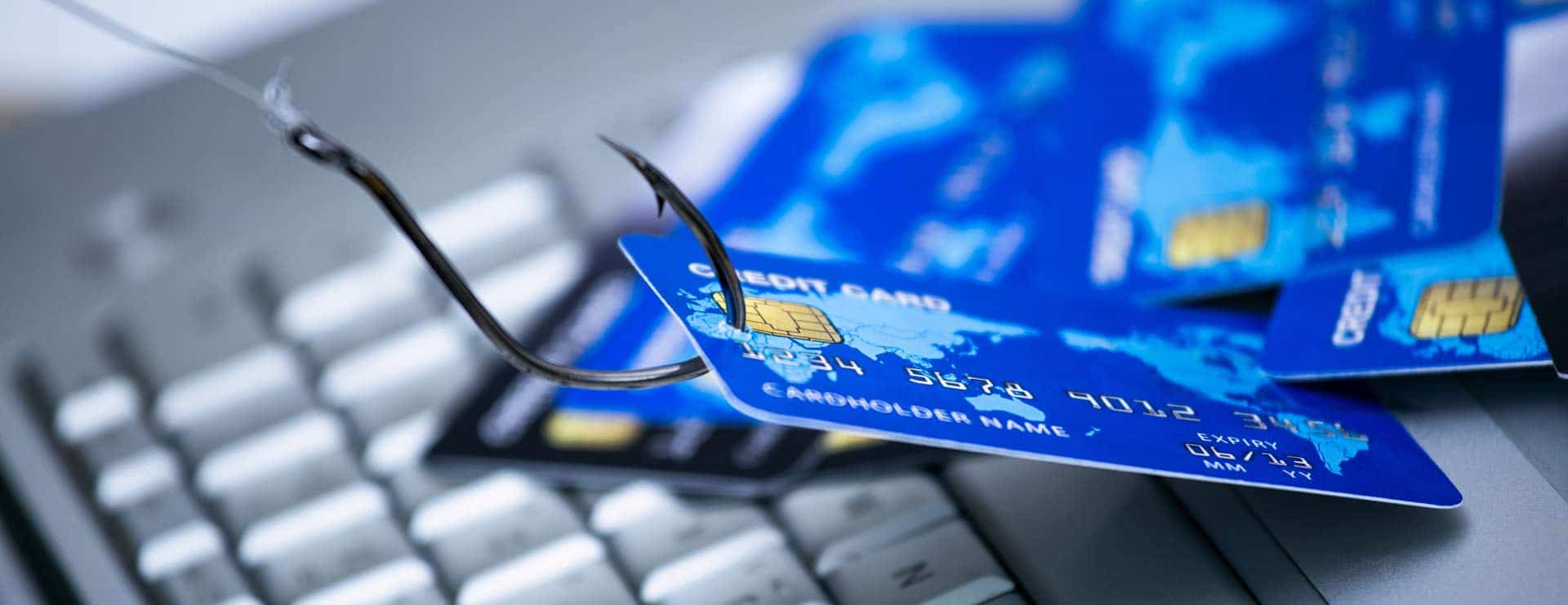 Blue bank card hooked by credit card fraud